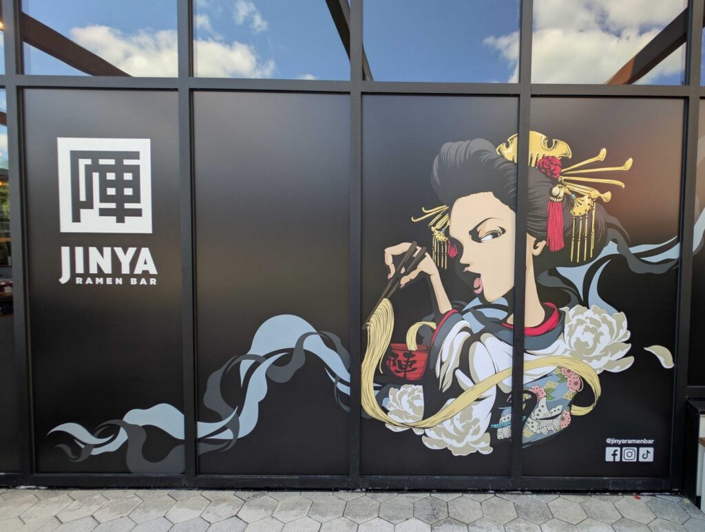 Custom window graphics installed for JINYA Ramen Bar. Professionally printed storefront graphics designed to enhance branding and attract customers.